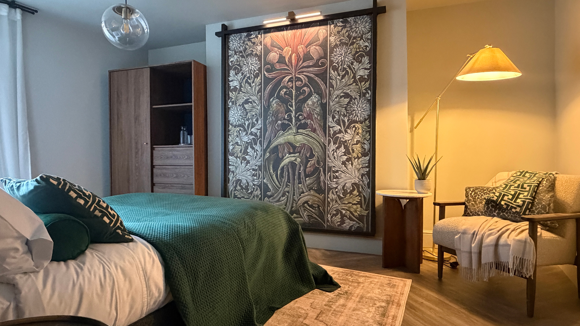 Spring Suite interior — light, fresh, uplifting, styled with natural wood, plants and luxury Egyptian cotton